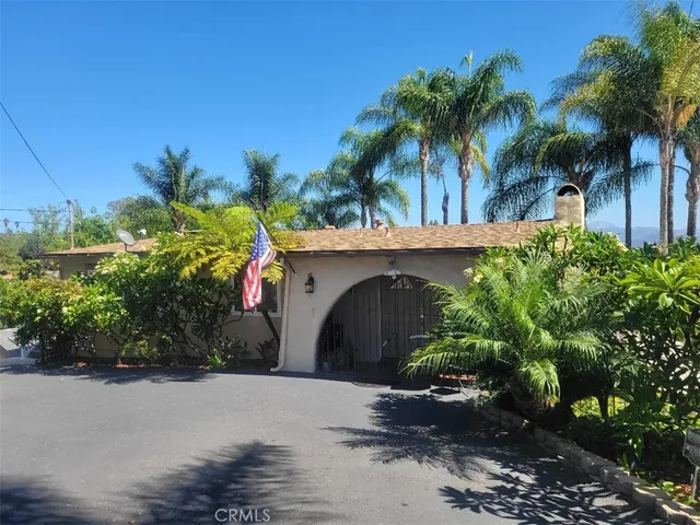 a view of a house with a street