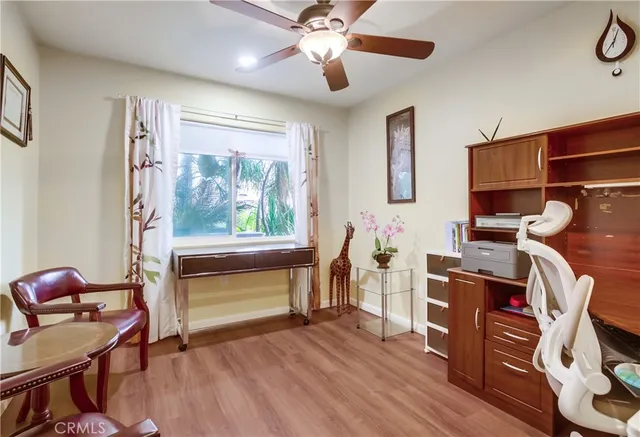 a bedroom with furniture and a window