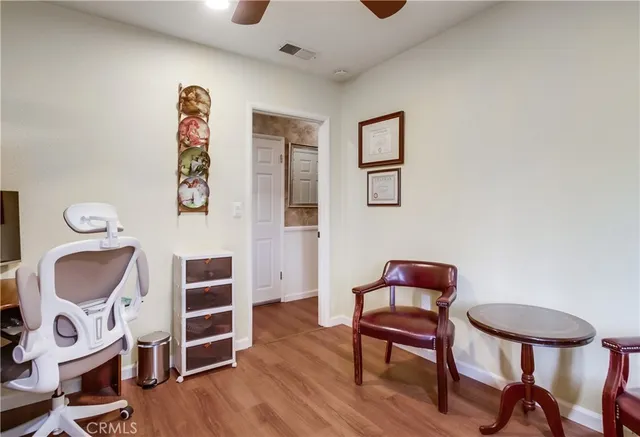 a living room with furniture and a chair