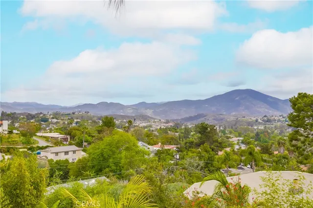 a view of a city with mountains in the background