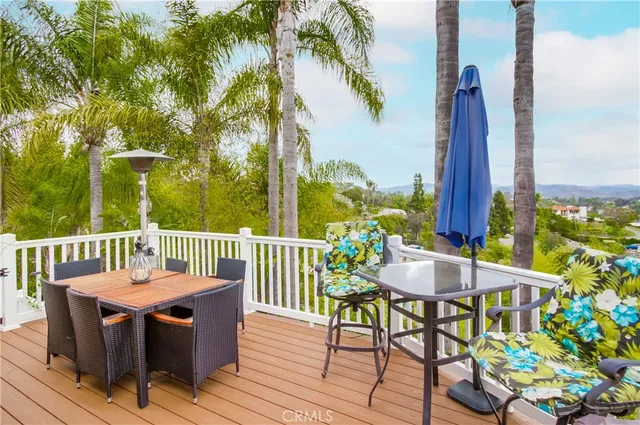 a view of a chairs and table on the deck