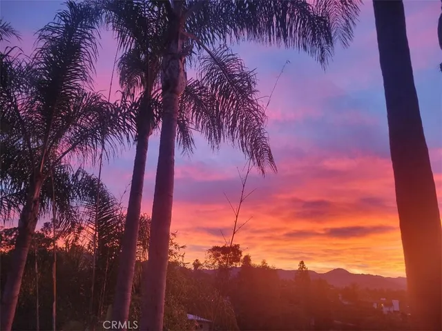 a view of a backyard of a house with a mountain