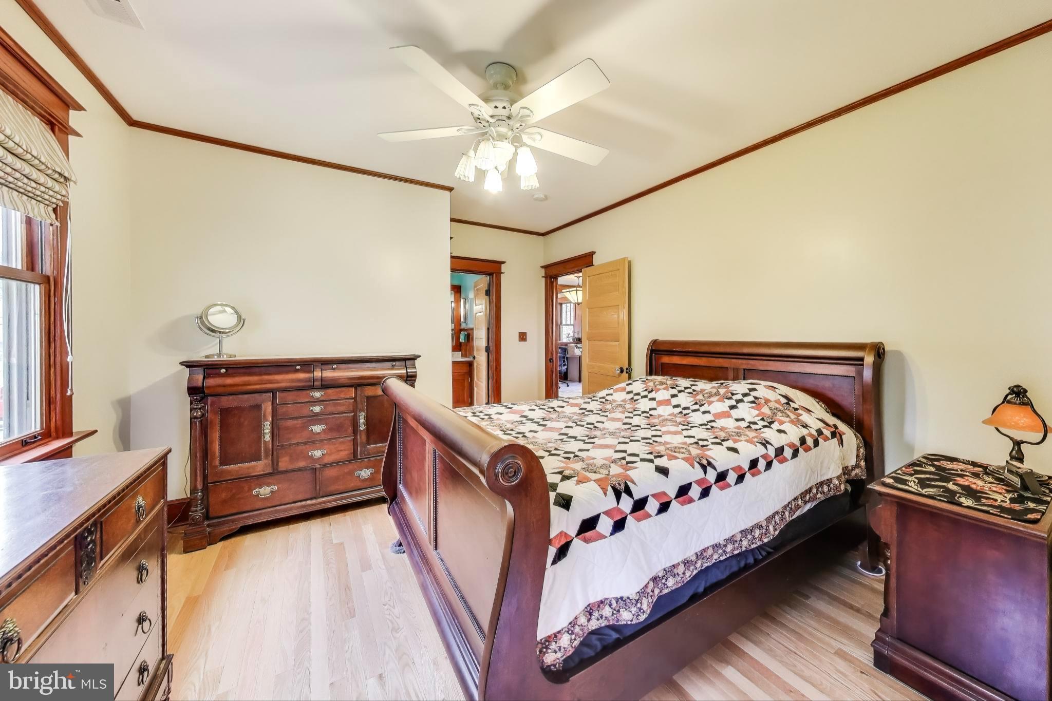 2400 Valley Way Cheverly, MD 20785 - Photo 16 of 42 Primary bedroom with classic wooden accents.