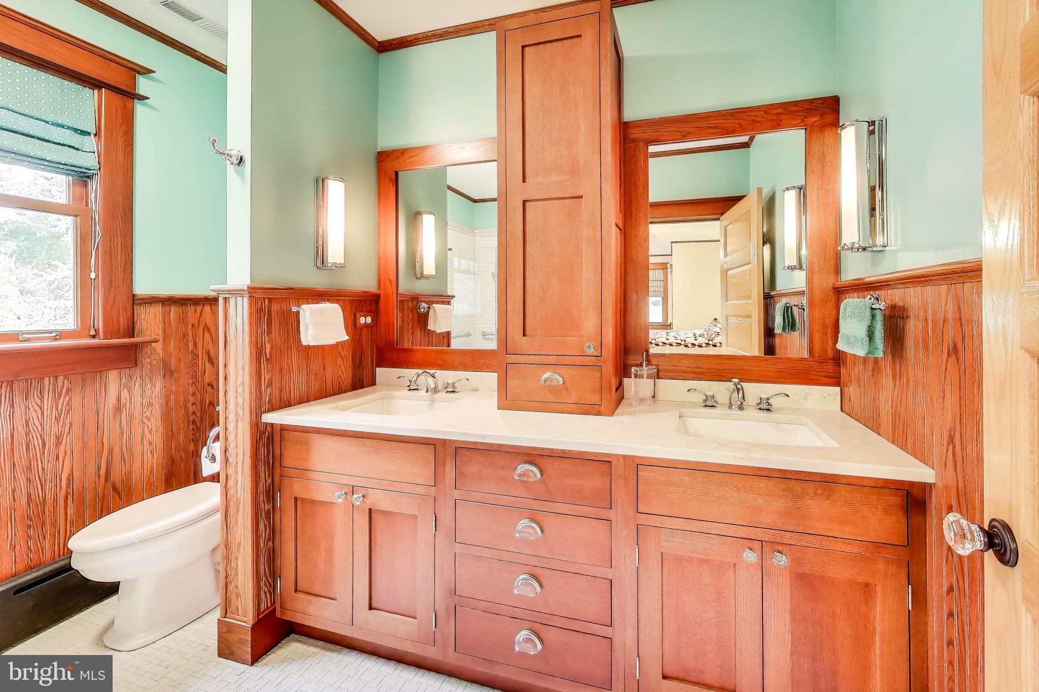 2400 Valley Way Cheverly, MD 20785 - Photo 18 of 42 Elegant bathroom with rich wood accents.