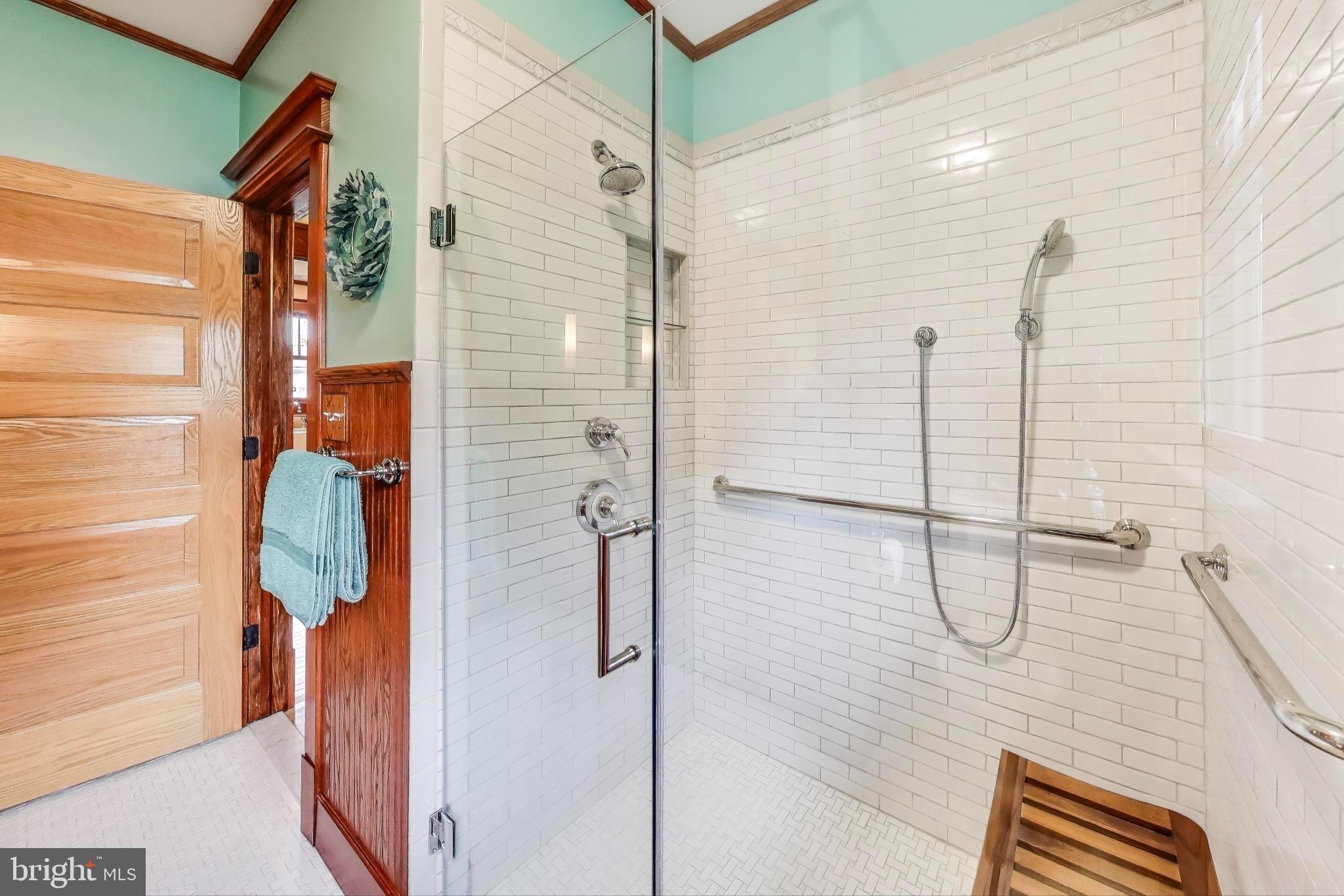 2400 Valley Way Cheverly, MD 20785 - Photo 19 of 42 Elegant shower with modern tile accents.