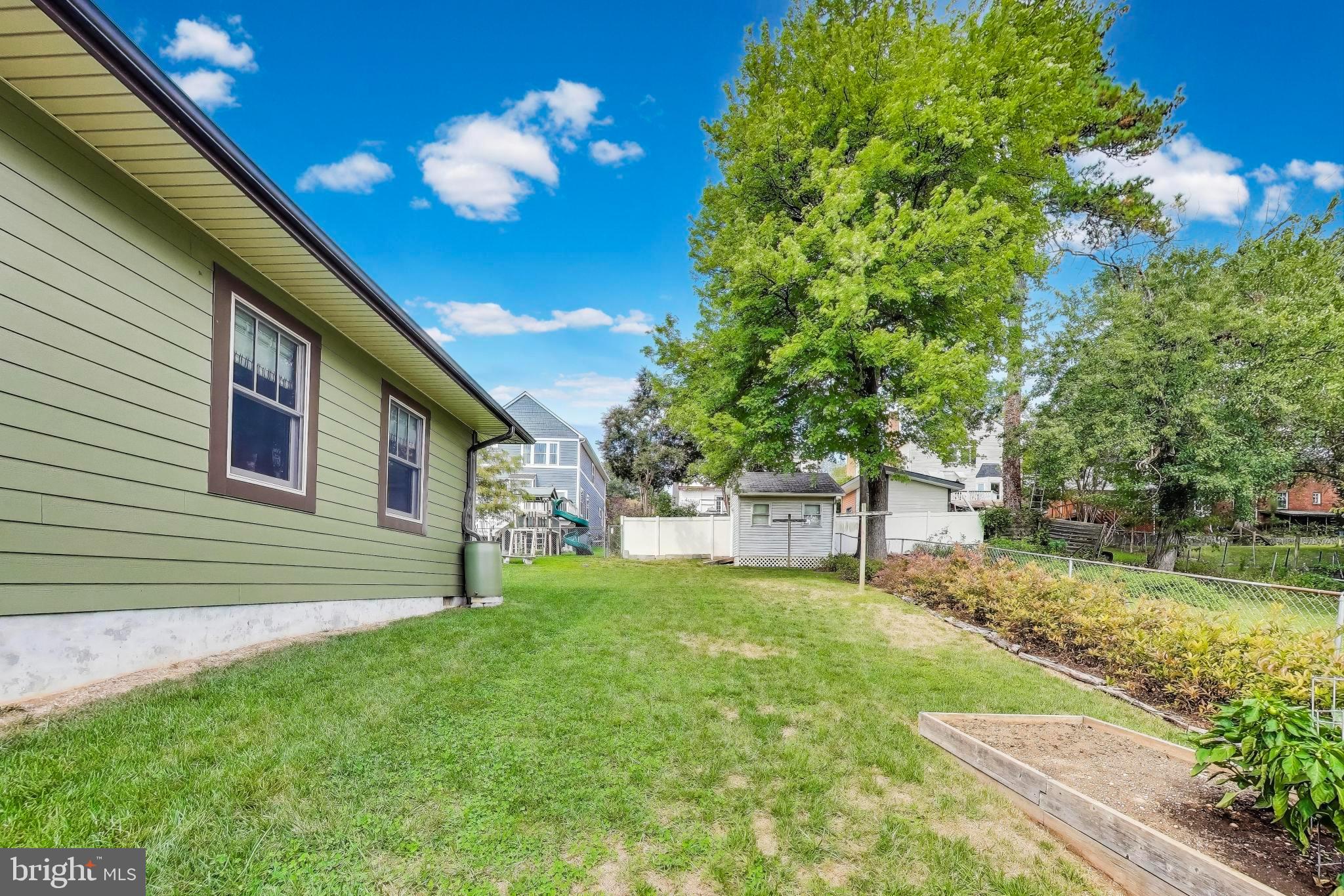 2400 Valley Way Cheverly, MD 20785 - Photo 34 of 42 Lush backyard oasis with vibrant greenery.