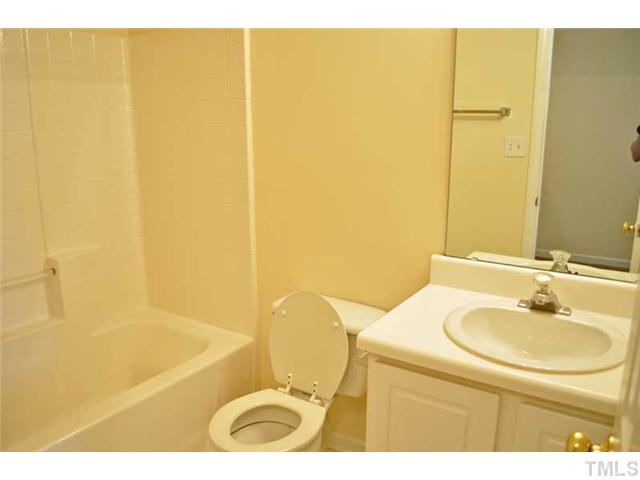 8501 Neuse Hunter Drive Raleigh, NC 27616 - Photo 12 of 16 a bathroom with a sink a toilet and shower