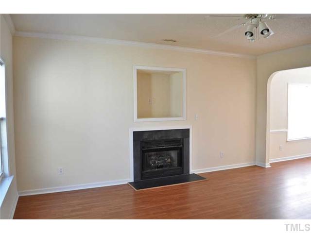 8501 Neuse Hunter Drive Raleigh, NC 27616 - Photo 2 of 16 a view of an empty room with wooden floor and a window