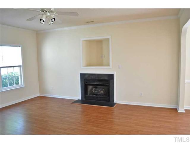 8501 Neuse Hunter Drive Raleigh, NC 27616 - Photo 4 of 16 a view of an empty room with wooden floor and a window