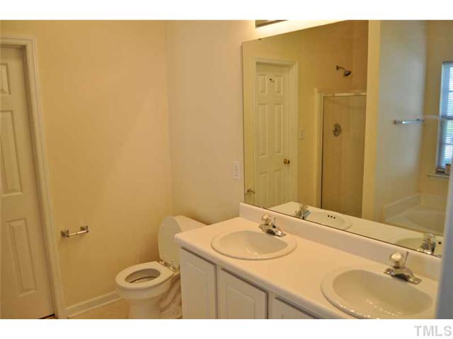 8501 Neuse Hunter Drive Raleigh, NC 27616 - Photo 10 of 16 a bathroom with a sink and a mirror