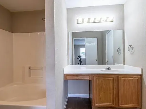 a bathroom with a sink and a mirror