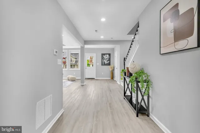 wooden floor in kitchen and an entryway with wooden floor