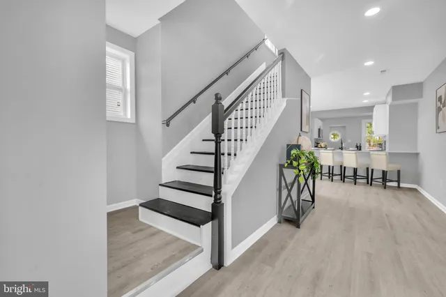 a view of entryway and dining room with furniture