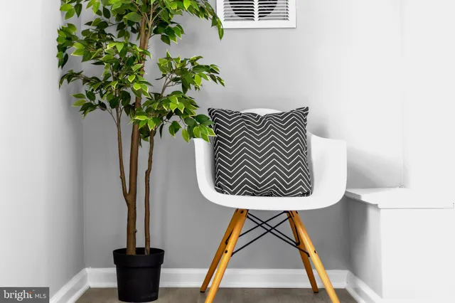 a blue and white vase with flowers