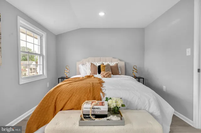 a bedroom with a bed and window