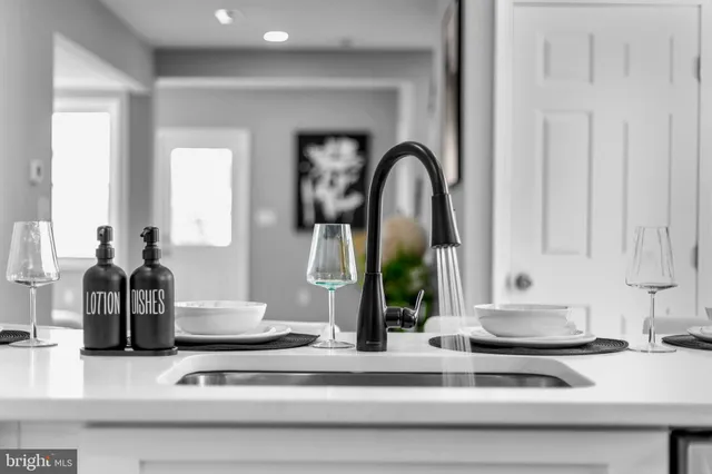 a kitchen with sink and window