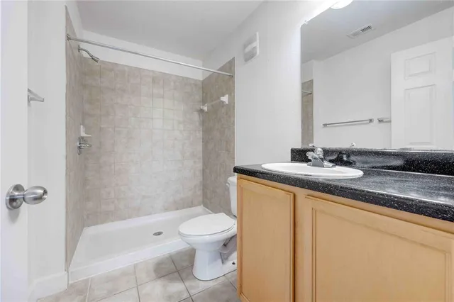 a kitchen with stainless steel appliances granite countertop a sink and a stove