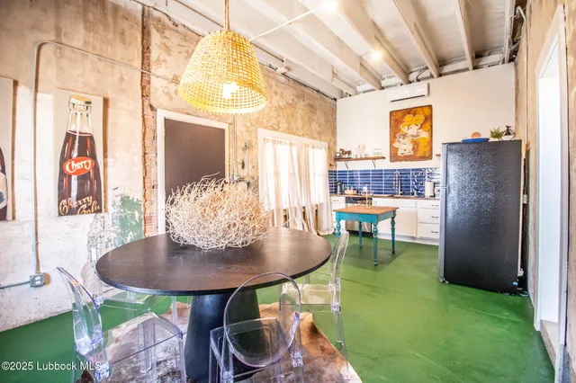 a kitchen with stainless steel appliances granite countertop a refrigerator a stove and a sink with cabinets