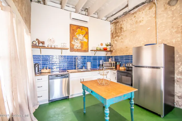 a kitchen with a sink and a stove