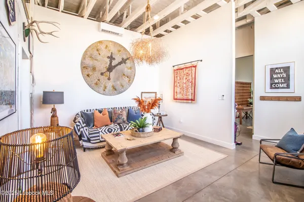 with a painting on a wall next to a white wall