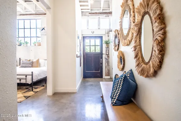 a bedroom with a bed and a mirror