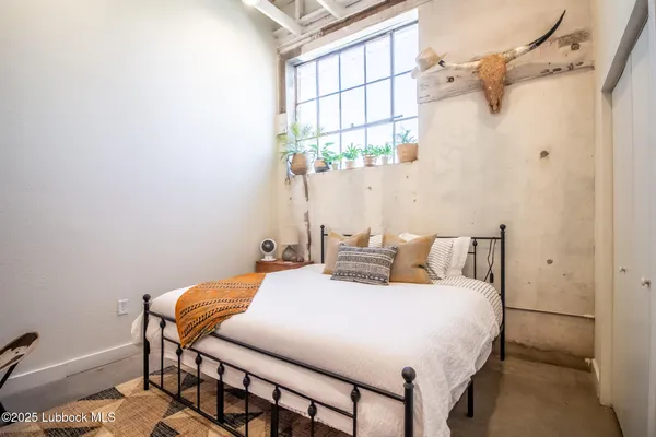 a reading room with furniture and a window