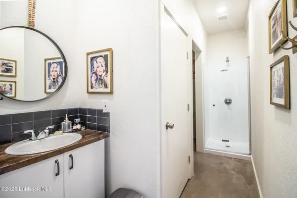 a bathroom with a sink and a mirror