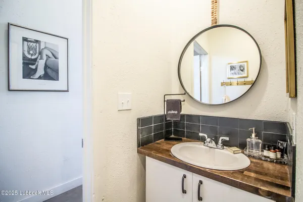 a white tub sitting next to a bathroom