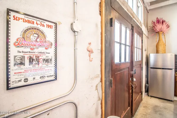 a living room with furniture a rug and a white walls