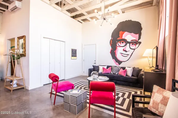 a living room with furniture and a window