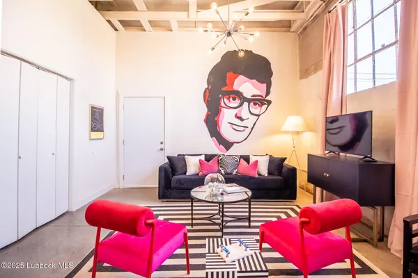 a living room with furniture and a table