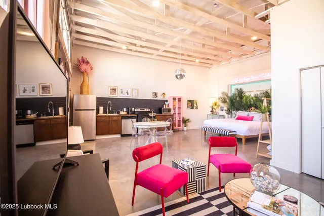 a kitchen with stainless steel appliances granite countertop a stove and a refrigerator