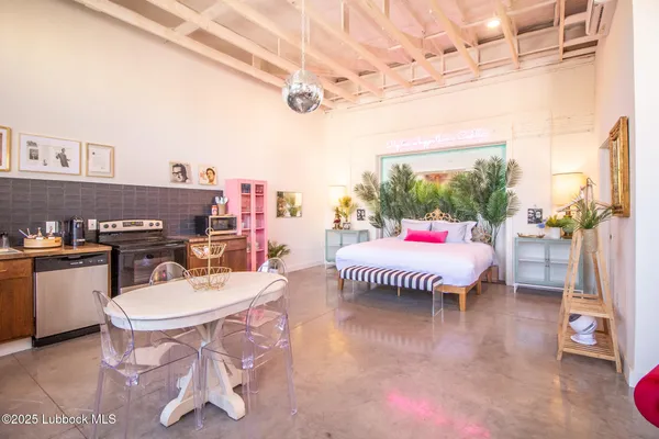 a large room with a lot of furniture and a chandelier