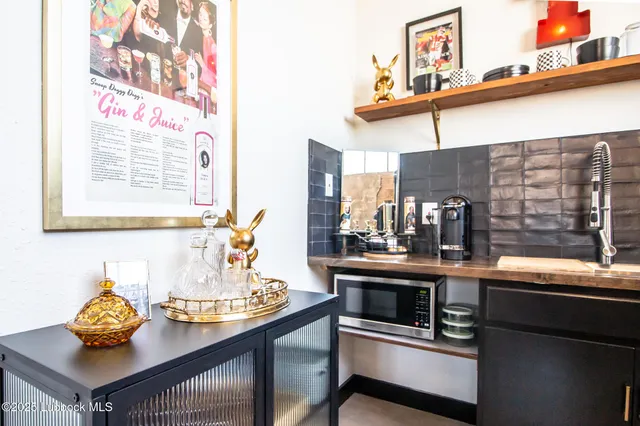 a kitchen with a sink and a stove