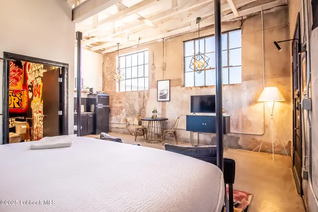 a bathroom with a sink mirror vanity and toilet
