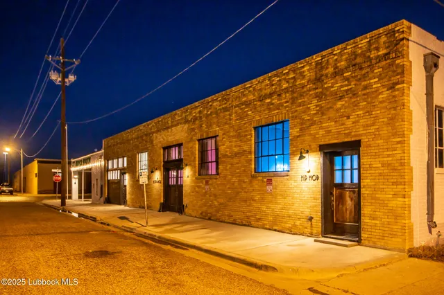 a dining room with furniture and a floor to ceiling window