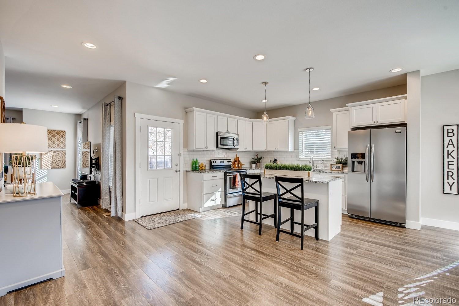 Stunning Kitchen offers All the Stainless Appliances, Granite Counters, Soft Close Cabinets and Drawers, Breakfast Nook and Large Stainless Sink.