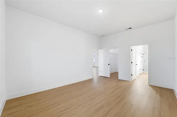 a bathroom with a double vanity sink mirror and shower