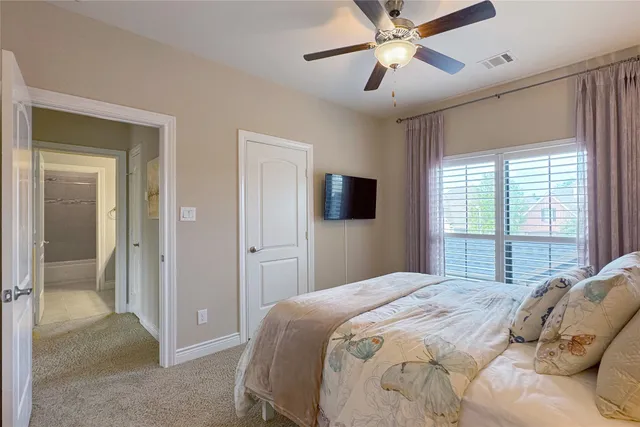 an aerial view of a house with a yard and outdoor seating