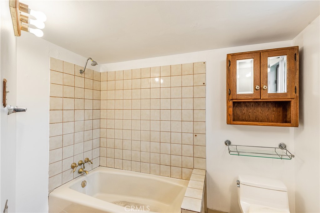 7444 Tranquil Drive Tujunga, CA 91042 - Photo 12 of 34 a bathroom with a bathtub and a shower