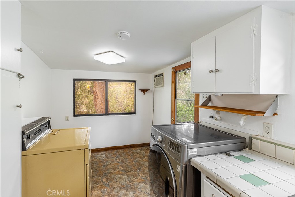 7444 Tranquil Drive Tujunga, CA 91042 - Photo 14 of 34 a kitchen that has a sink and a stove