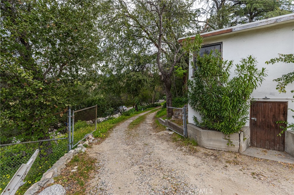 7444 Tranquil Drive Tujunga, CA 91042 - Photo 31 of 34 a backyard of a house with lots of green space
