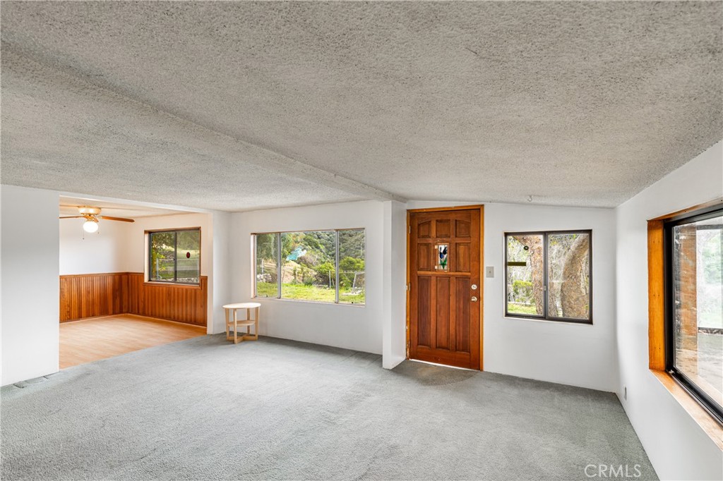 7444 Tranquil Drive Tujunga, CA 91042 - Photo 5 of 34 an empty room with windows and closet