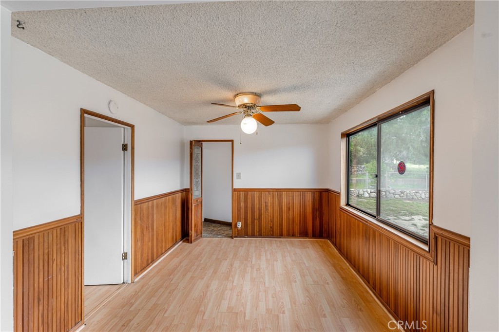 7444 Tranquil Drive Tujunga, CA 91042 - Photo 6 of 34 a view of a room with wooden floor fan and windows