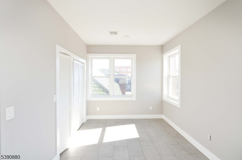 9 Watsessing Avenue, Unit 2R Bloomfield, NJ 07003 - Photo 2 of 14 a view of an empty room with a window