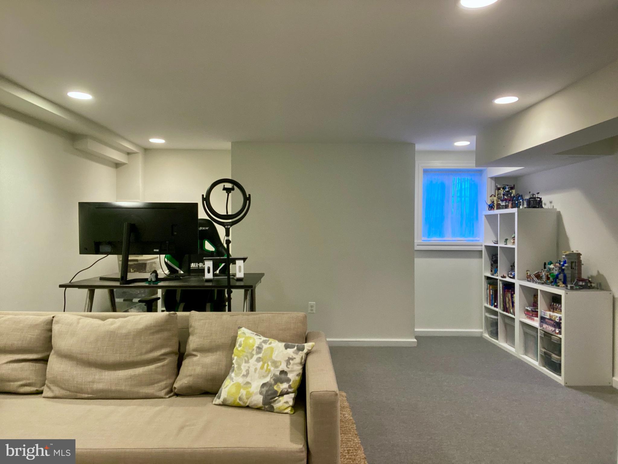121 Upnor Road Baltimore, MD 21212 - Photo 69 of 79 a living room with furniture and a flat screen tv