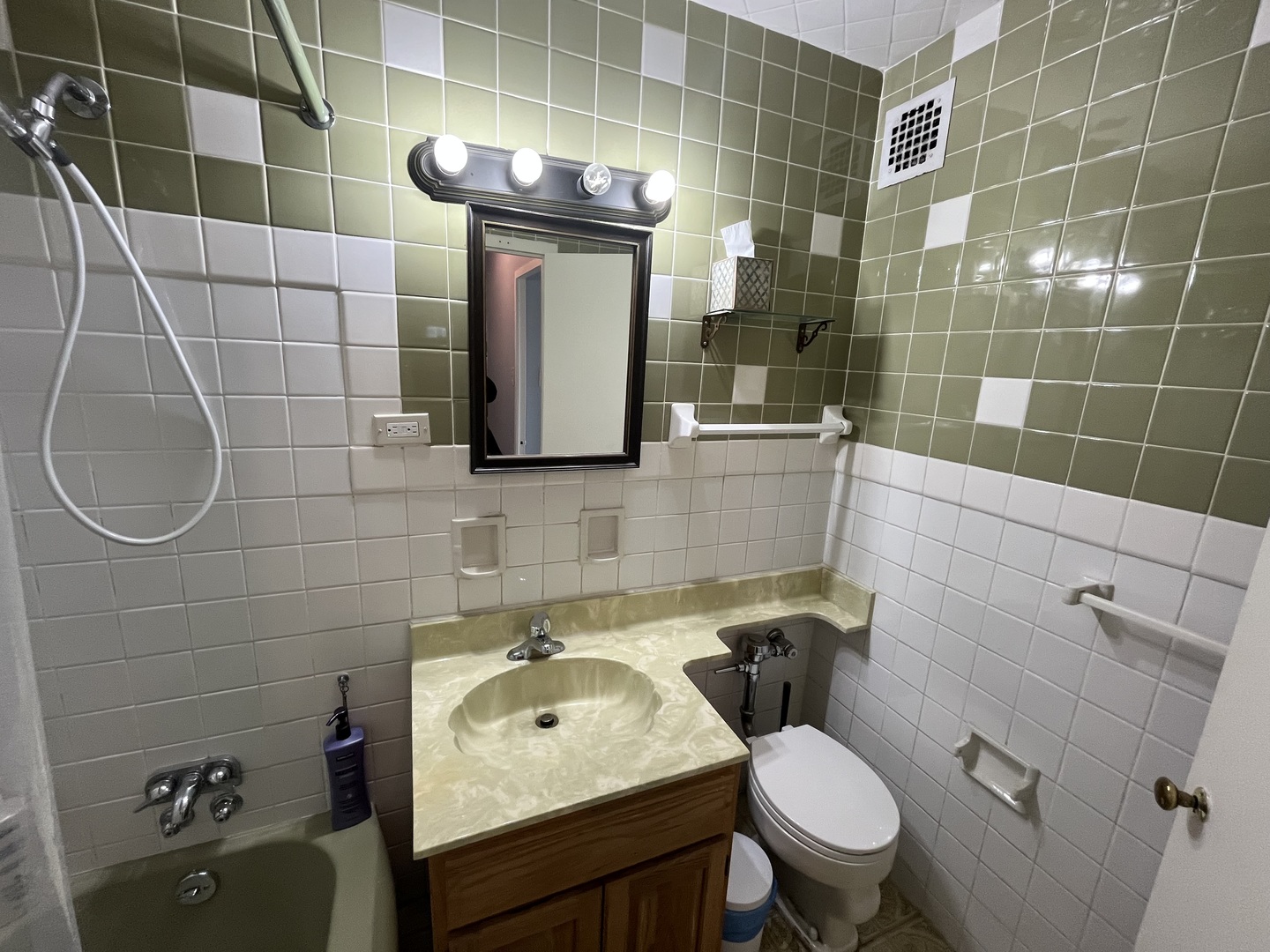 2909 North Sheridan Road, Unit 809 Chicago, IL 60657 - Photo 11 of 16 a bathroom with a sink toilet and shower