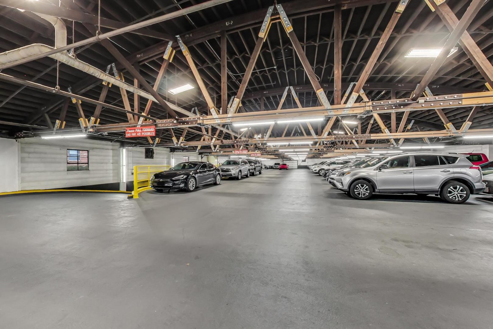 2909 North Sheridan Road, Unit 809 Chicago, IL 60657 - Photo 15 of 16 a view of parking garage with cars