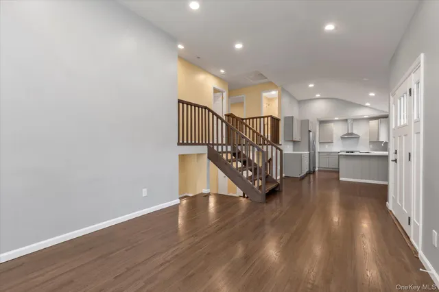 a view of entryway with wooden floor