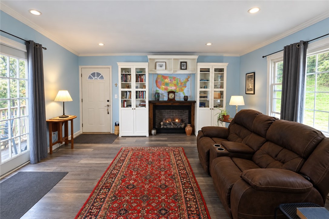 206 Kraham Road Cooperstown, NY 13326 - Photo 7 of 34 Enter into Sundroom/family room with gas fireplace